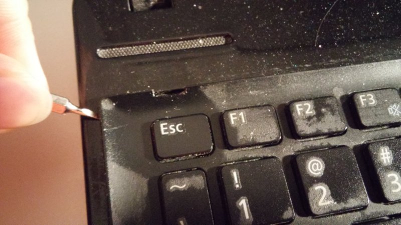 prying keyboard from top left-hand corner